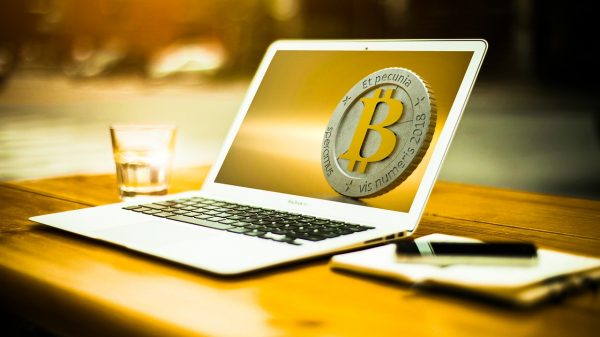 MacBook Air with Bitcoin logo as wallpaper