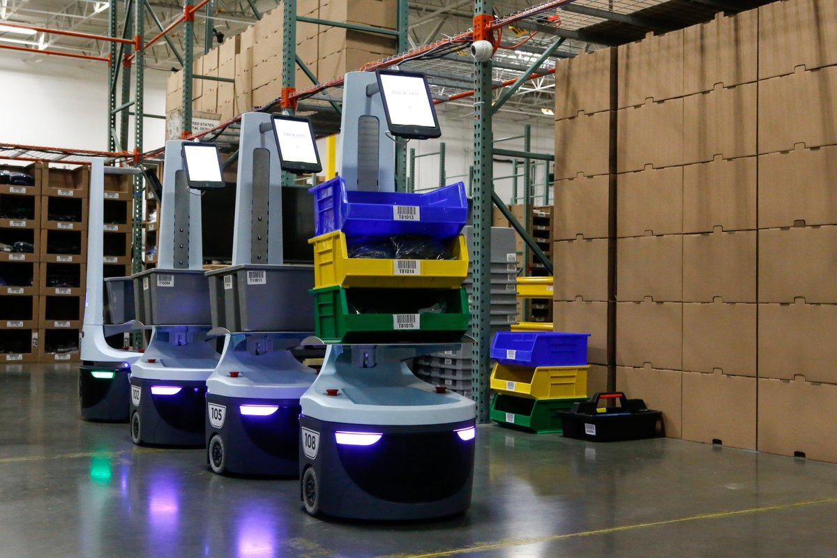 Collaborative robots inside a warehousing facility.