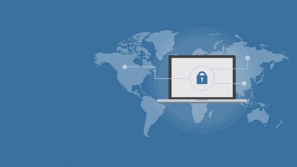 photo showing laptop downloading files from different parts of the world through torrents