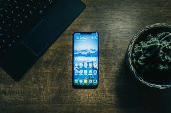 Android phone and a laptop keyboard.