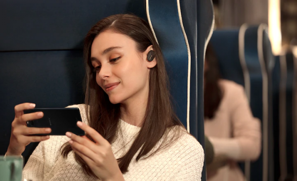 Woman Wearing Noise Canceling Earbuds