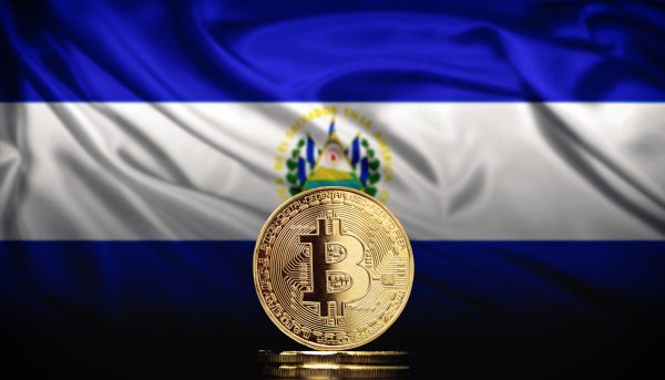 Bitcoin BTC representation coin with the national flag of El Salvador in background.
