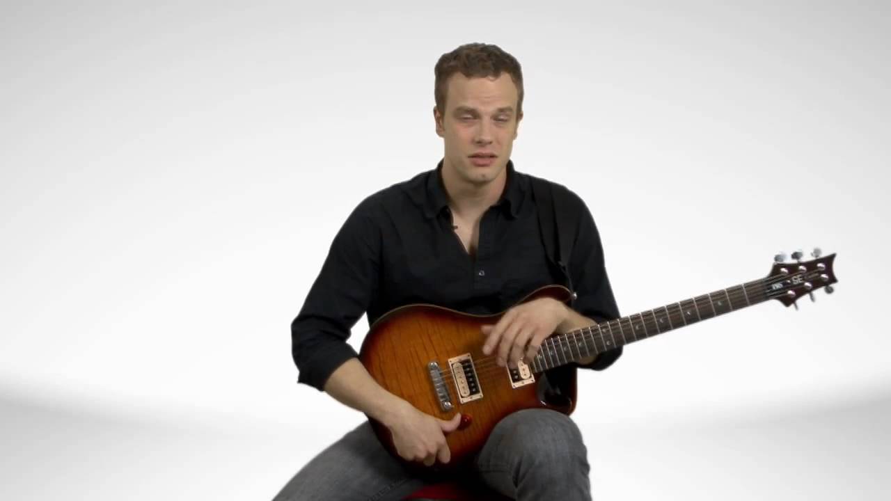 How To Hold An Electric Guitar Sitting Down