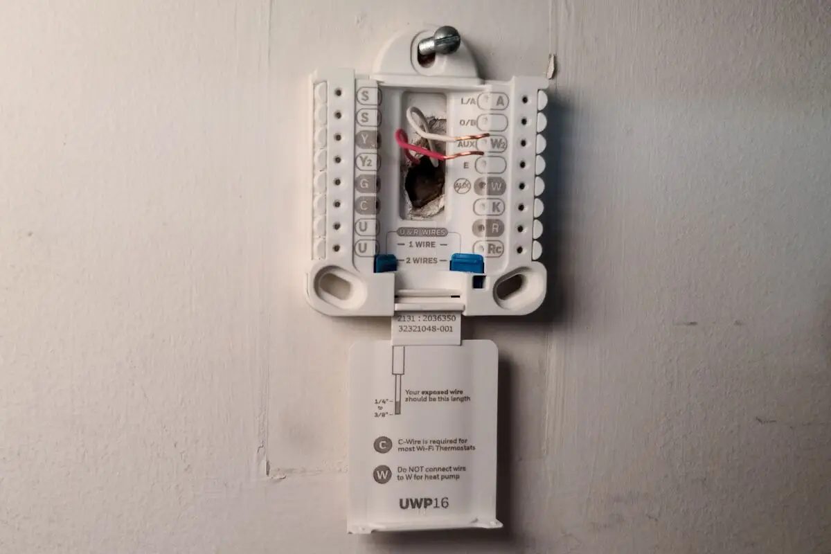 How do i remove this thermostat? Previous house had screws to i mount. Want  to check the wiring and get one I can control by time or a wifi thermostat.  : r/electrical