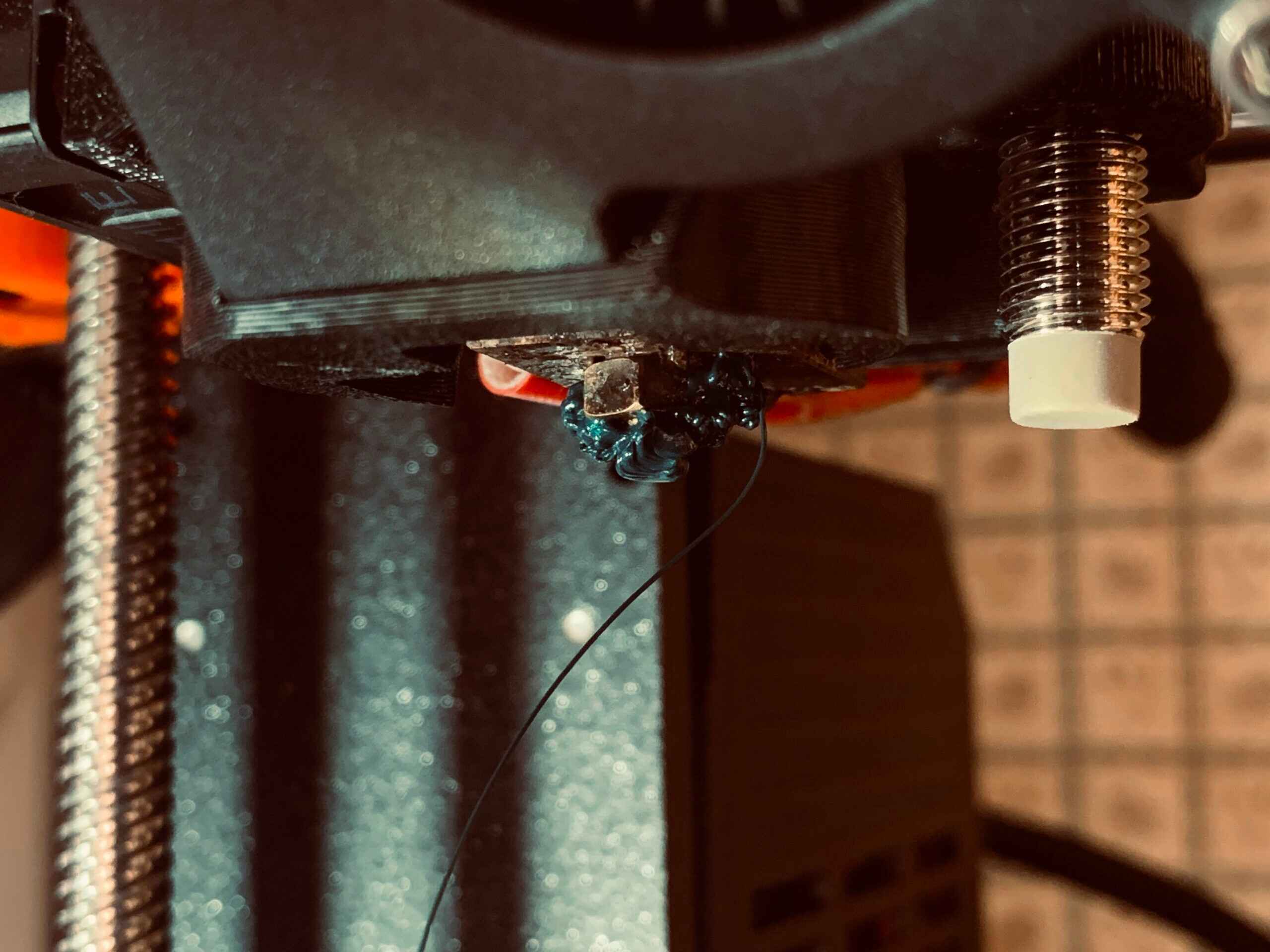 why-is-the-material-clumping-around-the-extruder-in-a-3d-printer